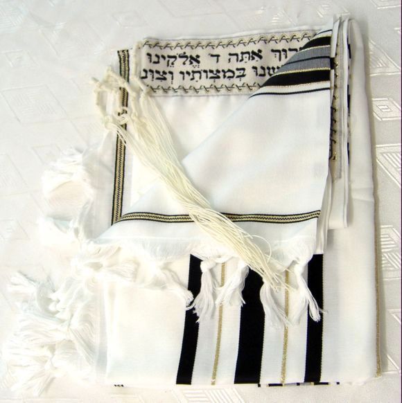 Before putting on a tallit, it is a customary tradition to kiss it and 