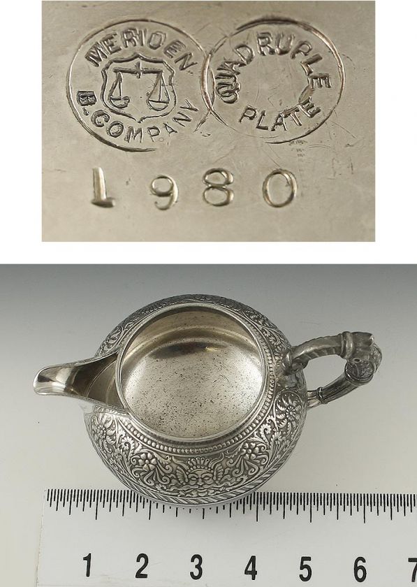 MERIDEN BRITANNIA ASSYRIAN HEAD PATTERN SILVER CREAMER  