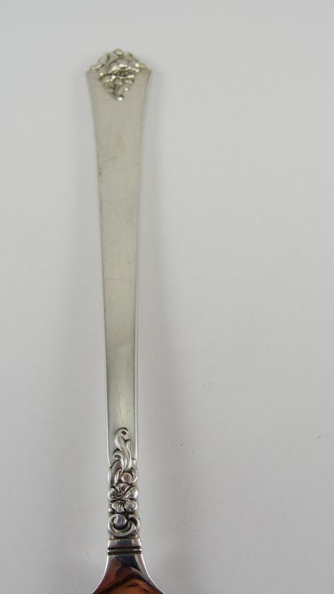   serving fork by Royal Crest Silver. It is in the Castle Rose pattern