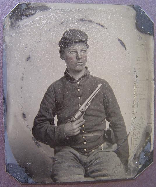   soldier in Union uniform with Colt Army Model 1860 revolver  